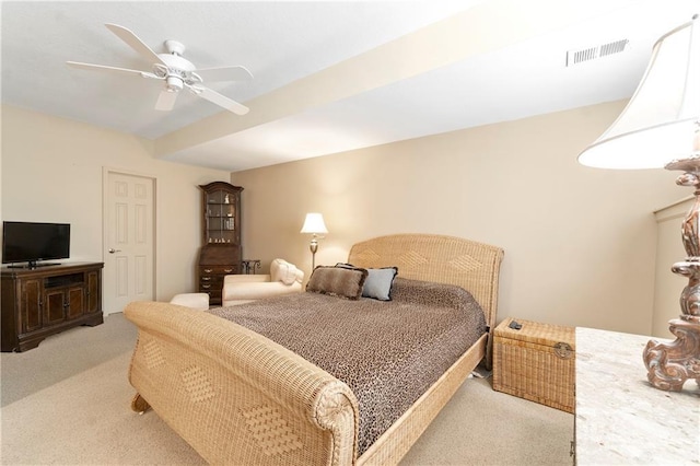 bedroom with light carpet, a ceiling fan, and visible vents