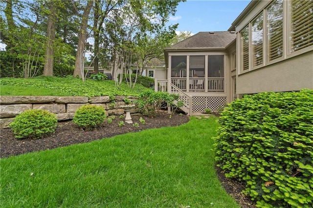 view of yard with a sunroom