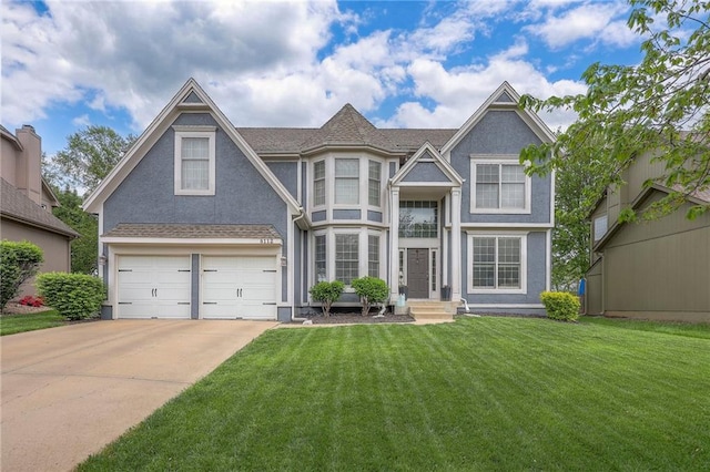 view of front of house featuring an attached garage, a front lawn, stucco siding, and concrete driveway