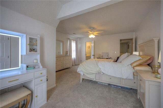 bedroom featuring ceiling fan and light carpet