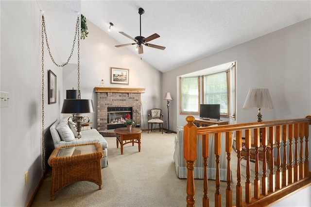 living area featuring a ceiling fan, carpet, a brick fireplace, high vaulted ceiling, and baseboards