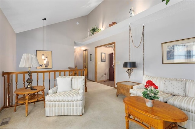 living room featuring light carpet and high vaulted ceiling