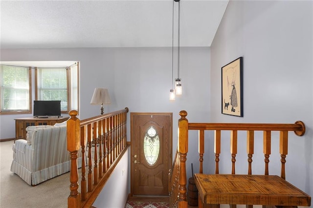 entryway with carpet floors