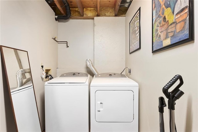 washroom with washing machine and clothes dryer