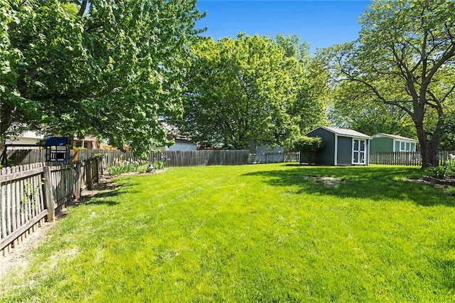 view of yard with a storage shed and an outdoor structure