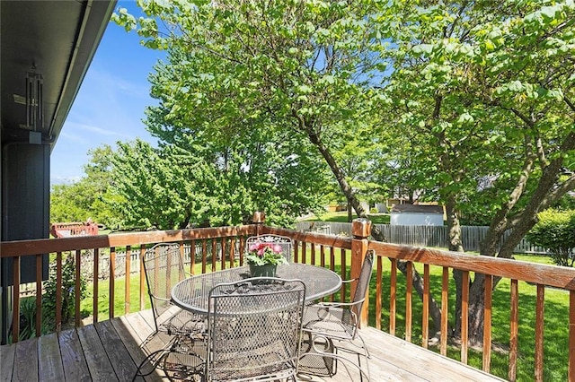 wooden deck featuring outdoor dining space