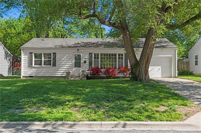 ranch-style home with crawl space, concrete driveway, a garage, and a front lawn