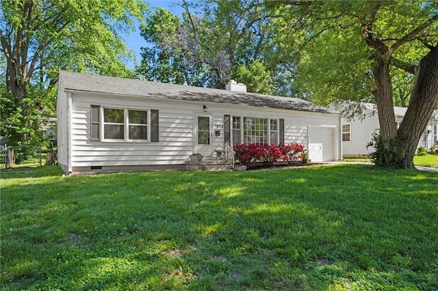 ranch-style home featuring a chimney, a front yard, crawl space, and a garage