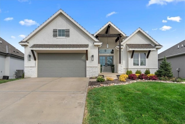 view of front facade featuring driveway, a garage, a front lawn, stone siding, and stucco siding