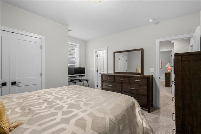 bedroom featuring light colored carpet