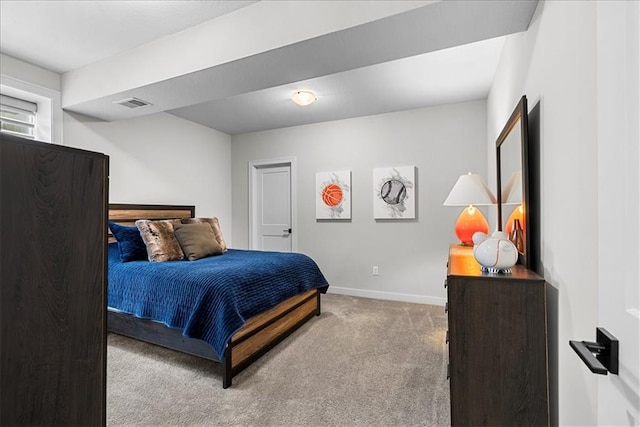 carpeted bedroom featuring baseboards and visible vents