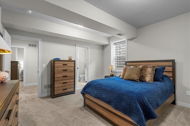 bedroom with light colored carpet, baseboards, and visible vents