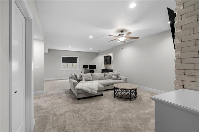 living area featuring carpet floors, a ceiling fan, baseboards, and recessed lighting