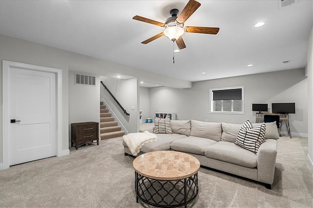 carpeted living room featuring ceiling fan, visible vents, stairs, baseboards, and recessed lighting