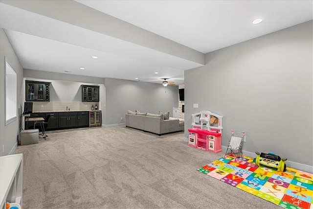 game room featuring baseboards, carpet floors, recessed lighting, and wet bar