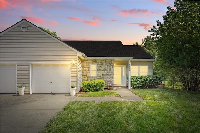 2111 N 83rd Pl, Kansas City, KS 66109 - view of front of home featuring concrete driveway, a yard, stone siding, an attached garage, and roof with shingles