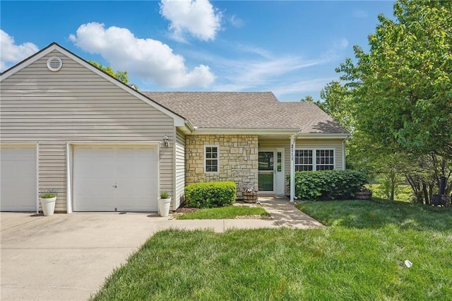 2111 N 83rd Pl, Kansas City, KS 66109 - view of front of home featuring concrete driveway, a front yard, stone siding, an attached garage, and roof with shingles