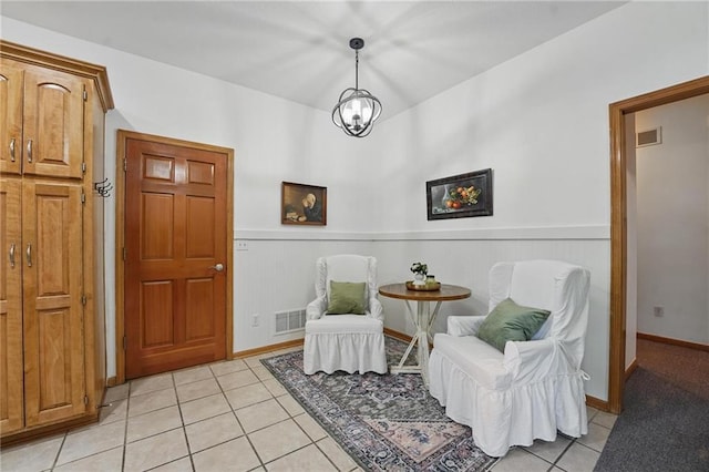 2111 N 83rd Pl, Kansas City, KS 66109 - living area with light tile patterned flooring and wainscoting