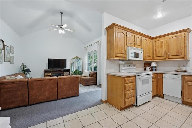 2111 N 83rd Pl, Kansas City, KS 66109 - kitchen with white appliances, open floor plan, light carpet, light countertops, and light tile patterned floors