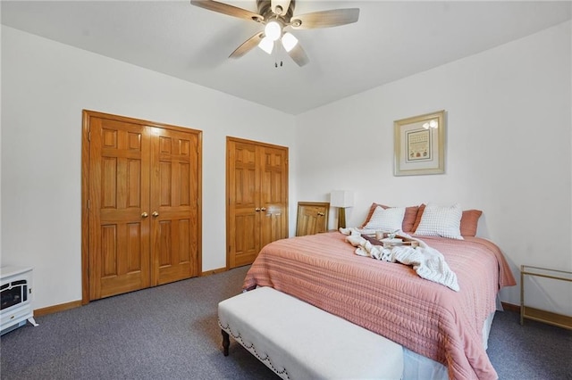 2111 N 83rd Pl, Kansas City, KS 66109 - bedroom with carpet floors, two closets, and ceiling fan