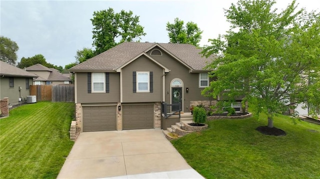 1125 SW Hillcrest Dr, Blue Springs, MO 64015 - raised ranch with concrete driveway, a garage, and brick siding
