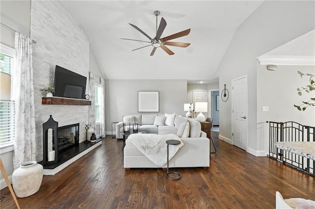 1125 SW Hillcrest Dr, Blue Springs, MO 64015 - living area with a ceiling fan, a fireplace, wood finished floors, and high vaulted ceiling