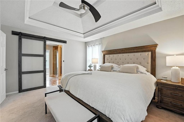 1125 SW Hillcrest Dr, Blue Springs, MO 64015 - bedroom with a raised ceiling, light carpet, a barn door, and ceiling fan
