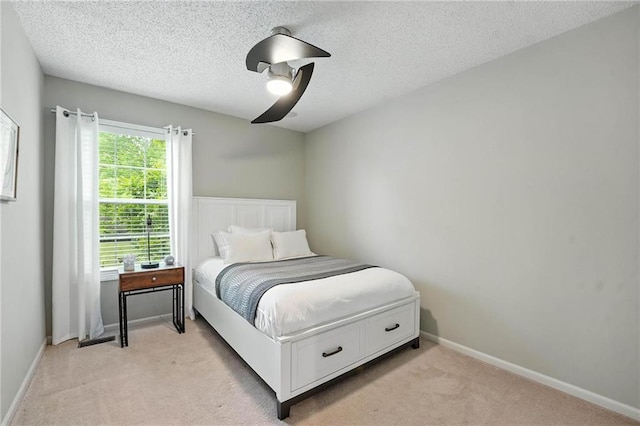 1125 SW Hillcrest Dr, Blue Springs, MO 64015 - bedroom featuring light colored carpet, a ceiling fan, and a textured ceiling