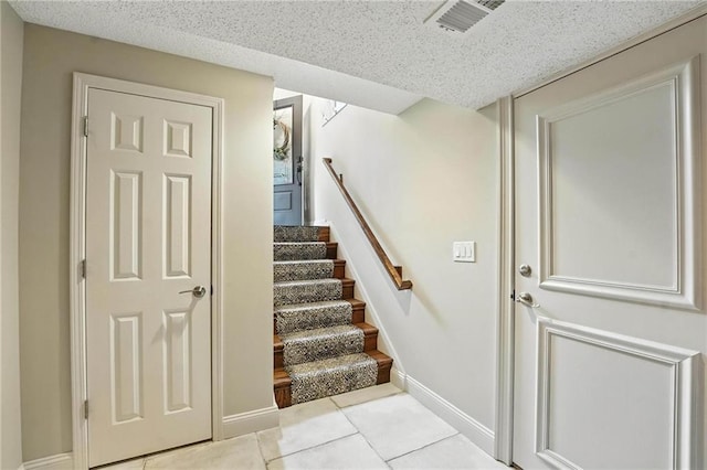 1125 SW Hillcrest Dr, Blue Springs, MO 64015 - staircase with baseboards and tile patterned floors