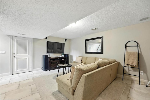 1125 SW Hillcrest Dr, Blue Springs, MO 64015 - living room featuring a textured ceiling and baseboards
