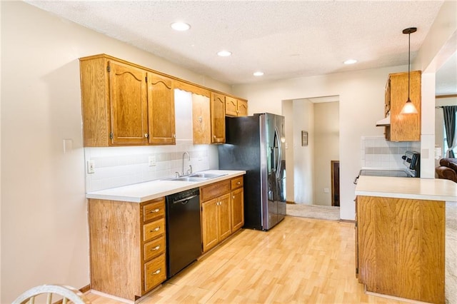 2109 NW Hidden Pointe Ct, Blue Springs, MO 64015 - kitchen featuring black dishwasher, range, stainless steel fridge with ice dispenser, backsplash, and light wood-type flooring