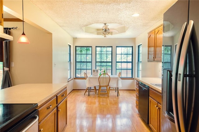 2109 NW Hidden Pointe Ct, Blue Springs, MO 64015 - kitchen featuring refrigerator with ice dispenser, black dishwasher, a textured ceiling, brown cabinetry, and light wood-style flooring