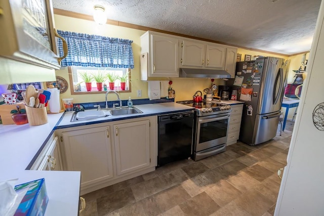 kitchen featuring under cabinet range hood, a textured ceiling, appliances with stainless steel finishes, and a sink