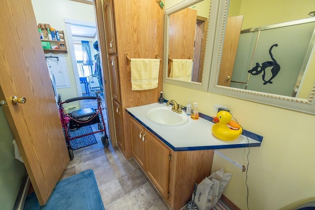 full bath featuring vanity and a shower stall