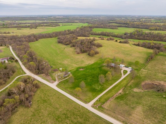 birds eye view of property featuring a rural view