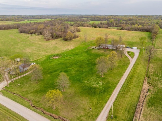birds eye view of property with a rural view