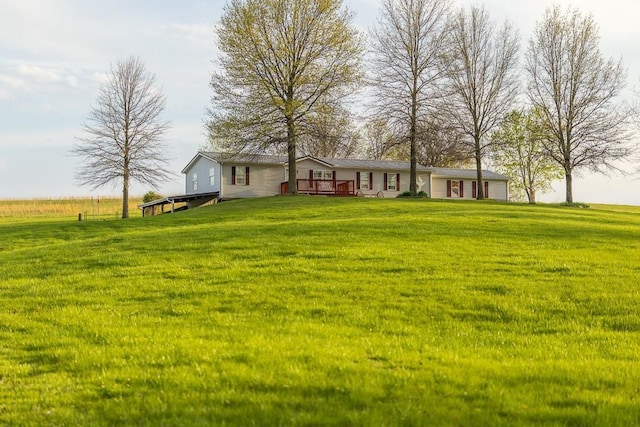 view of yard featuring a wooden deck