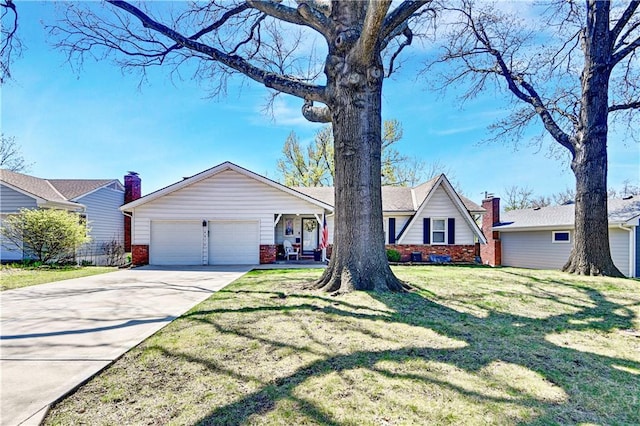 view of front of house with brick siding, an attached garage, driveway, and a front yard