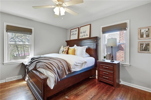 bedroom featuring baseboards, multiple windows, and visible vents