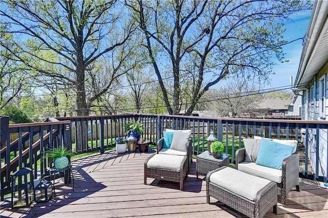 wooden deck with an outdoor living space