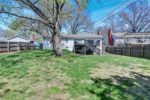 view of yard featuring stairs, a fenced backyard, a pergola, and a deck