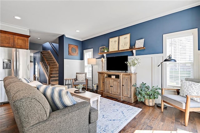 15841 Shawnee Dr, Overland Park, KS 66223 - living area with stairway, a wainscoted wall, healthy amount of natural light, a decorative wall, and dark wood-type flooring