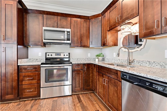15841 Shawnee Dr, Overland Park, KS 66223 - kitchen with appliances with stainless steel finishes, a sink, dark wood-style floors, and light stone counters