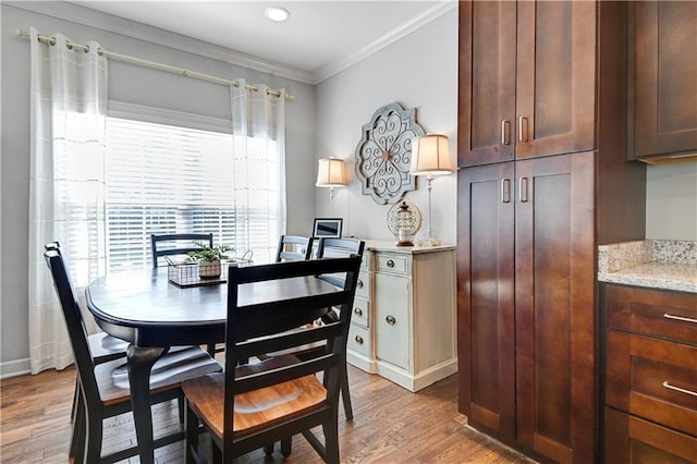 15841 Shawnee Dr, Overland Park, KS 66223 - dining space featuring wood finished floors, crown molding, and recessed lighting