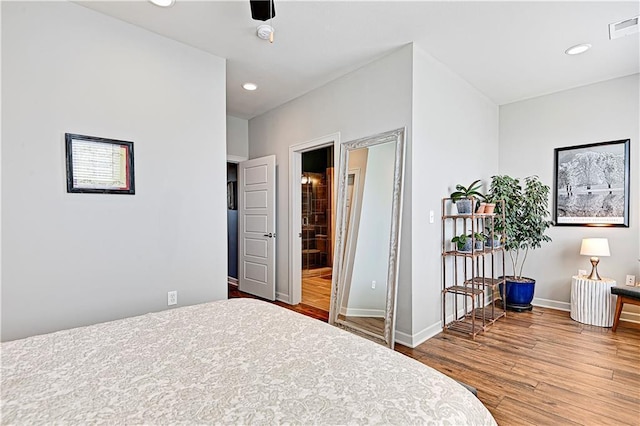 15841 Shawnee Dr, Overland Park, KS 66223 - bedroom with wood finished floors, baseboards, and recessed lighting