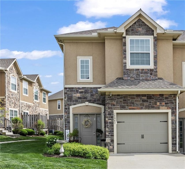 15841 Shawnee Dr, Overland Park, KS 66223 - view of property with stone siding, a garage, stucco siding, and concrete driveway