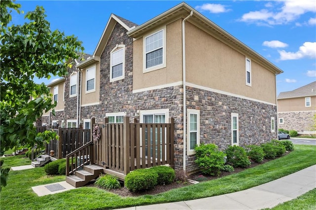 15841 Shawnee Dr, Overland Park, KS 66223 - view of home's exterior featuring stone siding and stucco siding