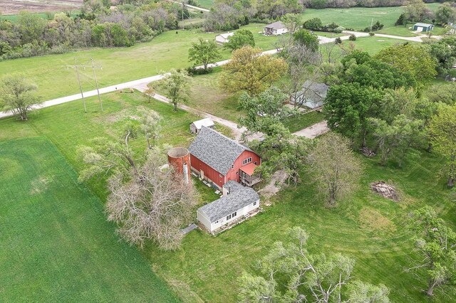 birds eye view of property with a rural view