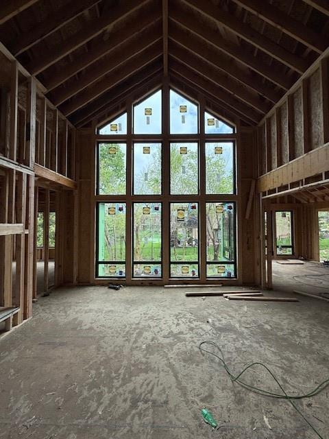 misc room with high vaulted ceiling