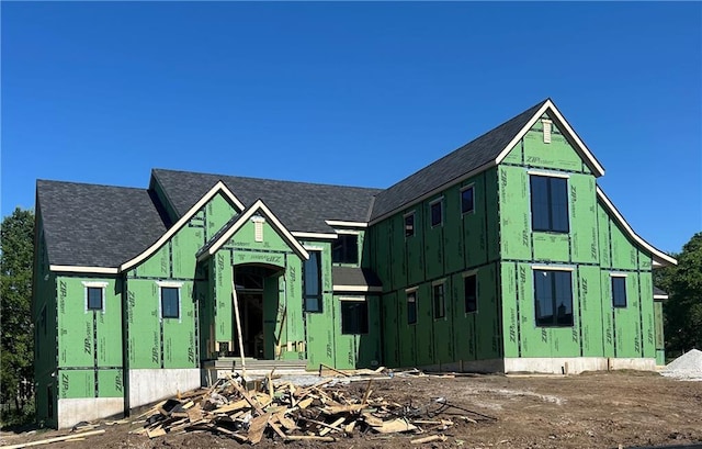 16905 Barton St, Overland Park, KS 66221 - property in mid-construction featuring board and batten siding and roof with shingles